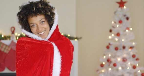 Attractive Woman in a Red Santa Cape with Hood