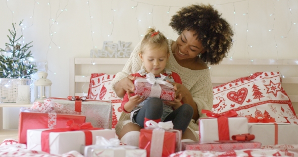 Daughter and Mother in Bed with Christmas Gifts