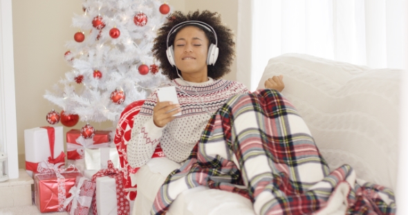 Happy Woman Listening To Music on Christmas Day