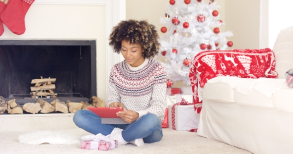 Young Woman Surfing the Internet at Christmas