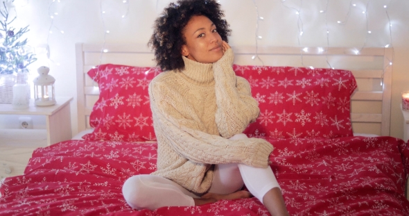 Young Woman Celebrating Alone at Christmas