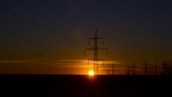 Sunset on the Background of Power Lines