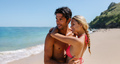 Affectionate young couple embracing on the beach - PhotoDune Item for Sale