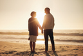 Senior couple standing on a beach together - PhotoDune Item for Sale