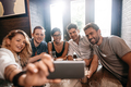Small group of friends taking selfie on a mobile phone - PhotoDune Item for Sale