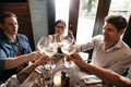 Group of people toasting wine at restaurant - PhotoDune Item for Sale