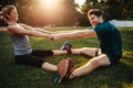 Young health couple doing stretching exercise - PhotoDune Item for Sale