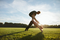 Young couple doing acrobatic yoga on lawn - PhotoDune Item for Sale