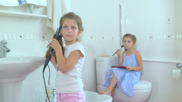 Little Girls Doing the Beauty in the Bathroom