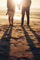 Senior couple holding hands on the beach - PhotoDune Item for Sale