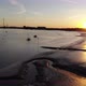 Flying into the sunset towards Dartford Bridge over Thames River at low tide - VideoHive Item for Sale
