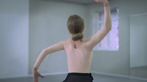 Back View Professional Slim Ballerina Dancing Indoors Moving Hands