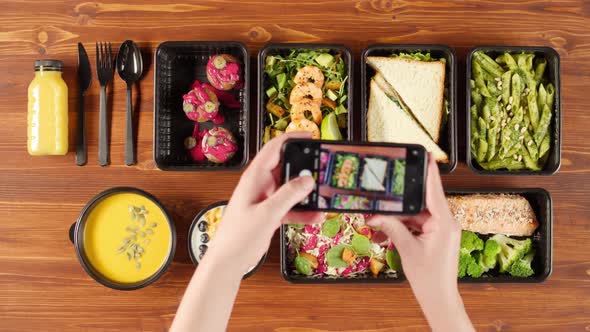 Food Delivery Top View Take Away Meals in Disposable Containers on Wooden Table