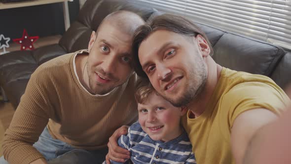POV of LGBTQ Couple and Little Boy Taking Selfie