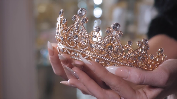 Woman Chooses Bridal Accessories in Wedding Boutique and Wear Crown with Diamonds