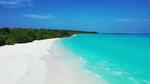 Wide angle birds eye copy space shot of a paradise sunny white sand beach and aqua turquoise water b