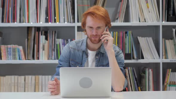 Phone Talk Redhead Man Attending Call at Work