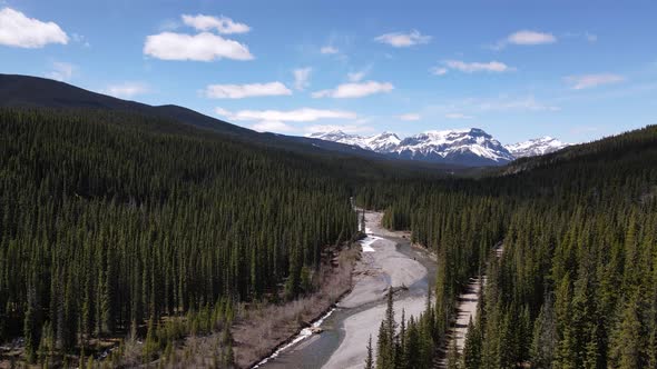 Aerial View Of River Near Crescent Falls Alberta Canada With Snow Top Mountains