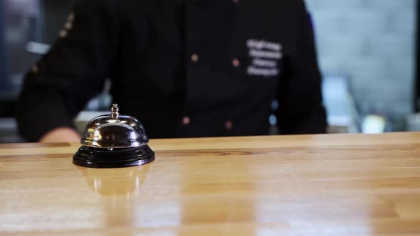 A Chef Rings the Bell and Serves a Plate with the Dish
