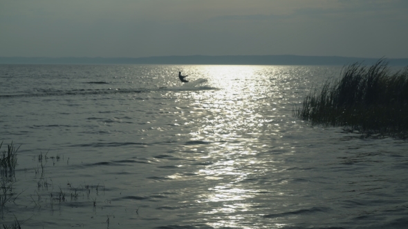 Kitesurfer on the Lake in Autumn Enjoy Extreme Sport