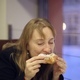 The Girl in the Cafe Drinking Tea and Eating a Bun - VideoHive Item for Sale