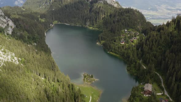 Aerial flies sideways and shows Lac de Tanay, Switzerland