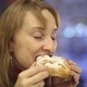 The Girl in the Cafe Drinking Tea and Eating a Bun - VideoHive Item for Sale