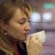 The Girl in the Cafe Drinking Tea - VideoHive Item for Sale