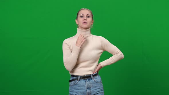 Portrait of Young Woman Feeling Hot on Green Screen