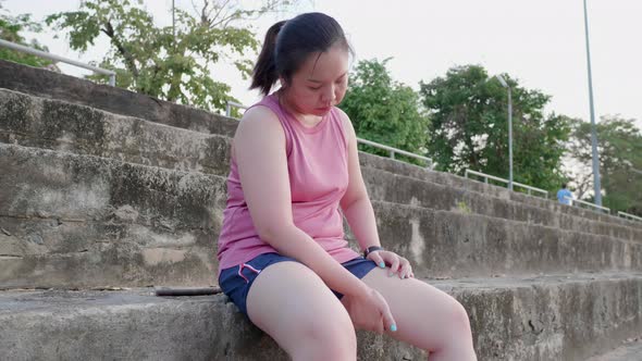 Unhappy boring overwieght of young sport Asian fat woman serious with belly legs