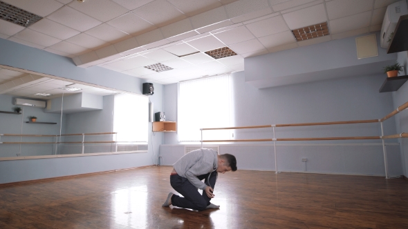 Young Dancer Is Rehearsing Dance for a Performance. Large Spacious Dance Studio