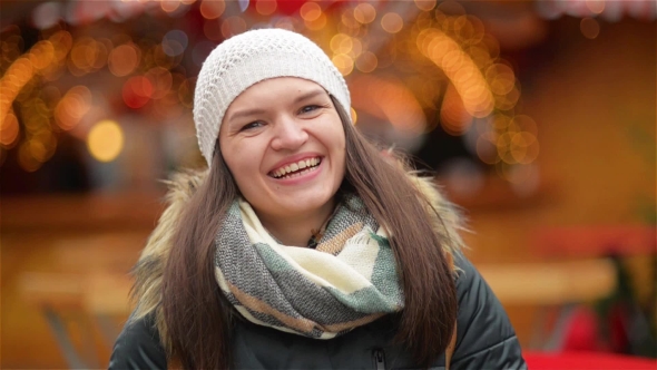 Happy Woman Portrait Outdoors on a Sunny Winter Day, Girl Laughing and Looking at the Camera