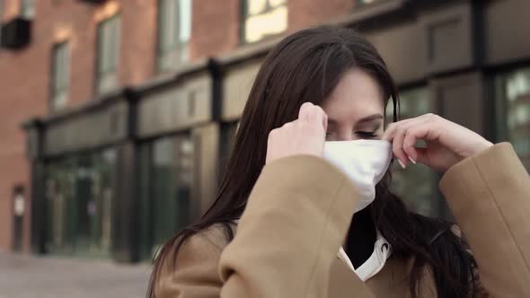 Girl Put on a White Virus Mask From Her Face and Breathes in the Air