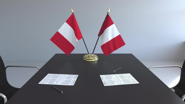 Flags of Peru and Papers on the Table alt
