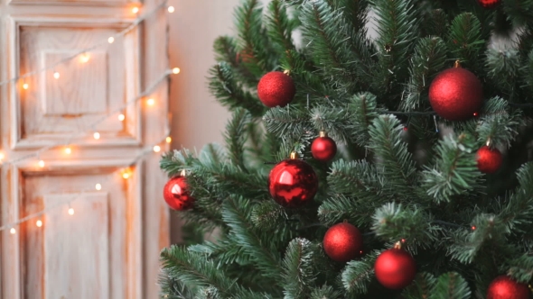 Cristmas Tree with Red Toys on Lights Background