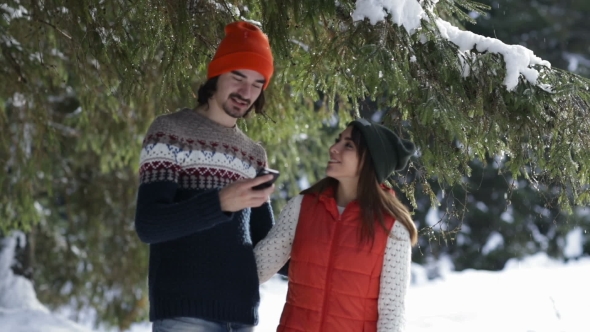 Romantic Couple Taking Selfie Photo Smart Phone Snow Forest Young Man And Woman Outdoor Winter Pine