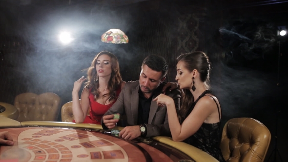 The Rich Man Surrounded By Two Prostitutes To Play and Win at the Casino