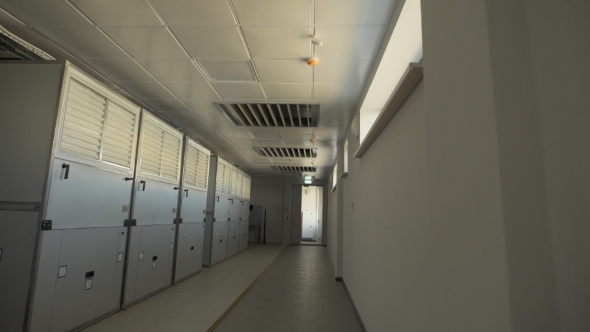 Camera Moves Along the Corridor Where There Are Large Wardrobes in Which Industrial Air Filters