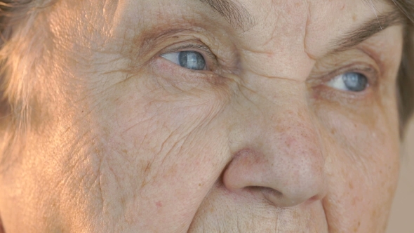 Elderly Woman's Face with Tired Expression of Face