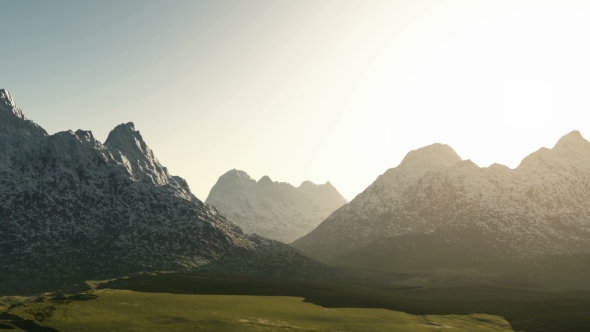 Green Valley and Mountains in Snow at Sunset alt