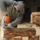 Builder Handles Wooden Timber Chainsaw. Against the Background Is Part of the Future of the House - VideoHive Item for Sale