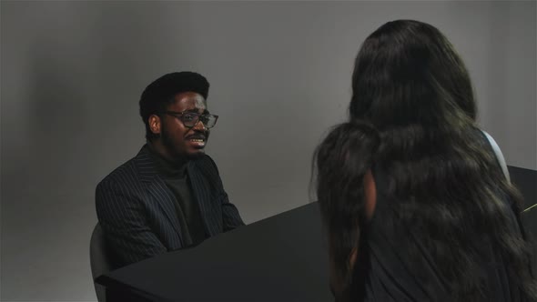 Stylish African American Man Romantically Sings and Plays a Melody on the Grand Piano for His Chosen