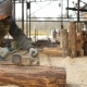 Construction Worker Planing a Piece of Wood for a Building Project. Construction Grinds Electric - VideoHive Item for Sale