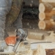 Builder Handles Wooden Timber Chainsaw. Against the Background Is Part of the Future of the House - VideoHive Item for Sale