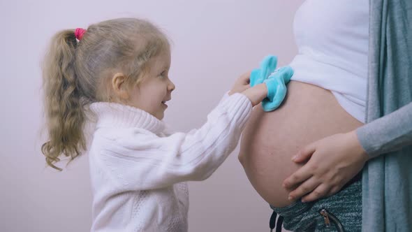 Girl Does Steps on Pregnant Mummy Tummy By Hand in Booties