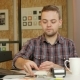 Man Pays Customer Purchase Cards in the Office Using the Terminal. He Holds and Pulls Out a Card - VideoHive Item for Sale