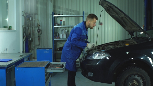 Mechanic at Work in His Garage