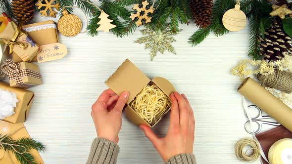 Woman hands packing gift