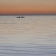 Calm Sea with a Rowing Boat with Two Fishermen at Sunset. - VideoHive Item for Sale