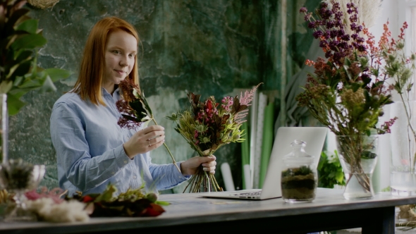 Cute Female Florist Arranging Bouqet